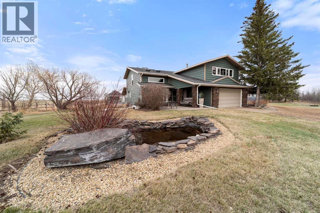 Front of the with a pond