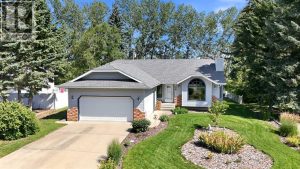 Great curb appeal highlighted by the beautiful front yard landscaping
