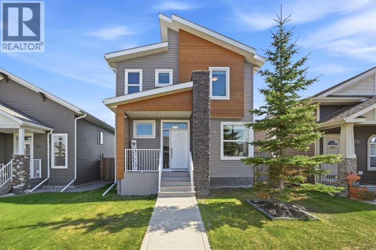 Modern rooflines, wood-grain siding accents, a covered composite front porch, and stone detailing create impressive curb appeal