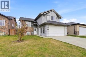 Welcome to 138 Jenner Crescent, a fully finished modified by level with an attached garage