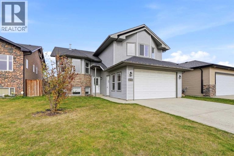 Welcome to 138 Jenner Crescent, a fully finished modified by level with an attached garage